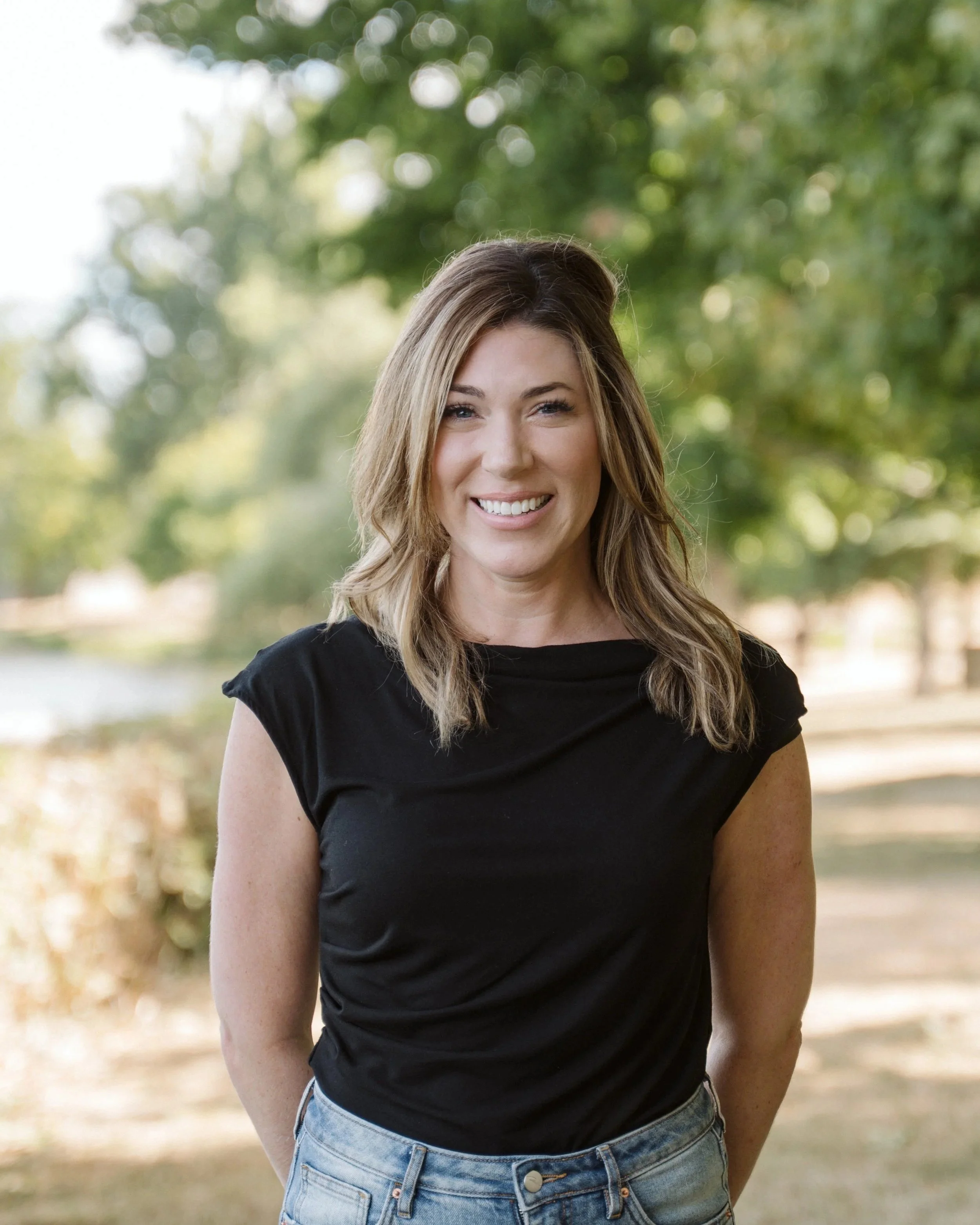 Photo of Kelly Office Manager with Forest Background