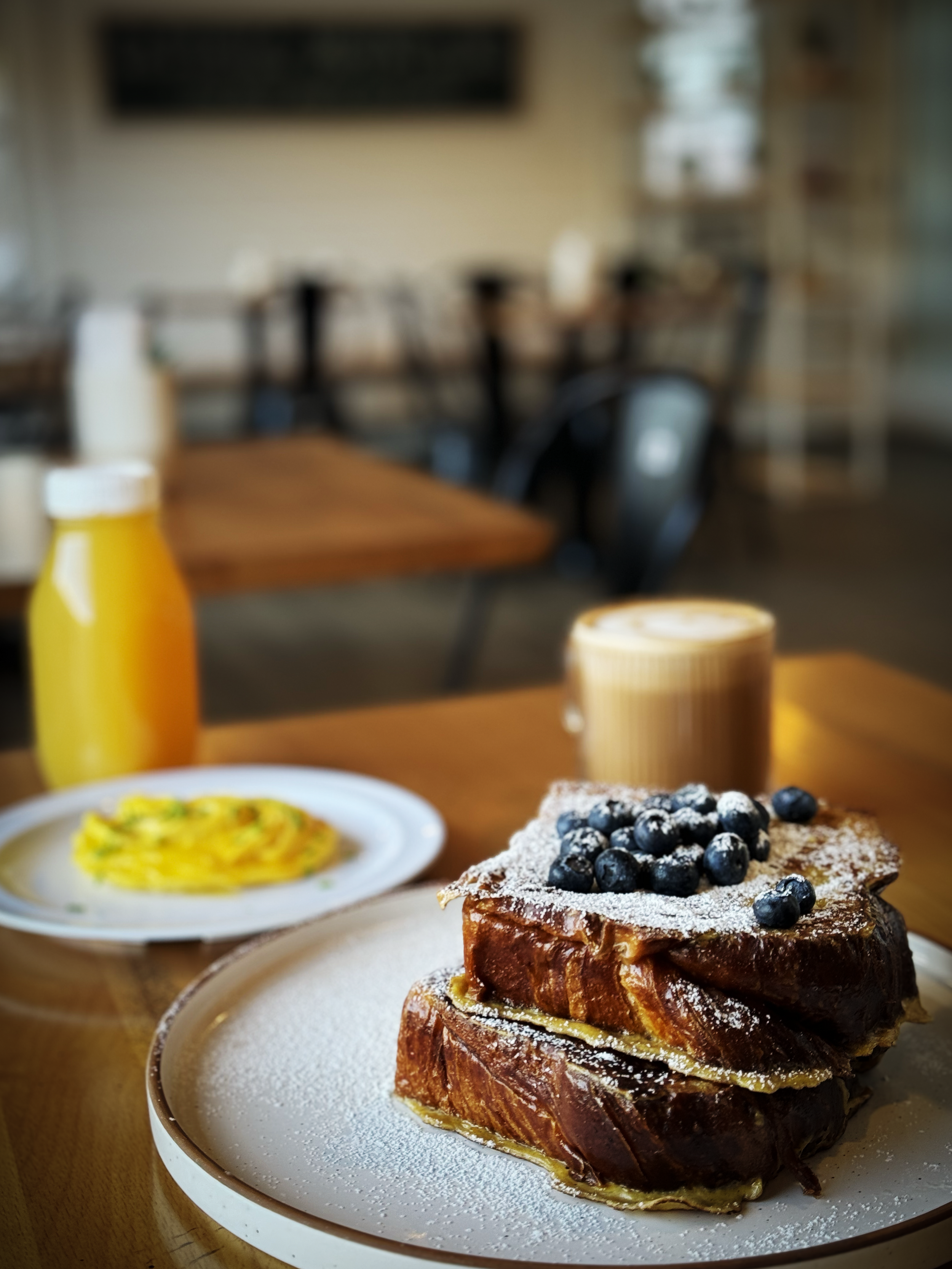Fresh Juice, Eggs and CROISSANT BREAD FRENCH TOAST - Croissant french toast, powdered sugar, fresh fruit, Hubbell local syrup