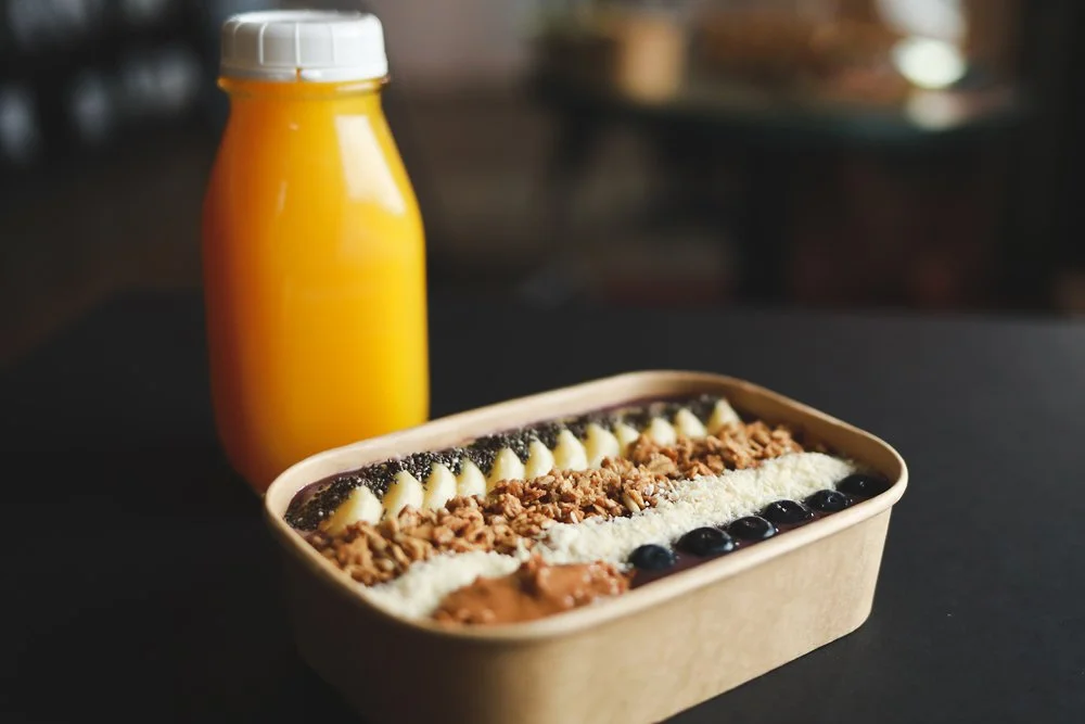 Acai Bowl - organic acai, banana, GF granola, shredded coconut, chia seeds, almond butter, and blueberries, with a fresh juice.