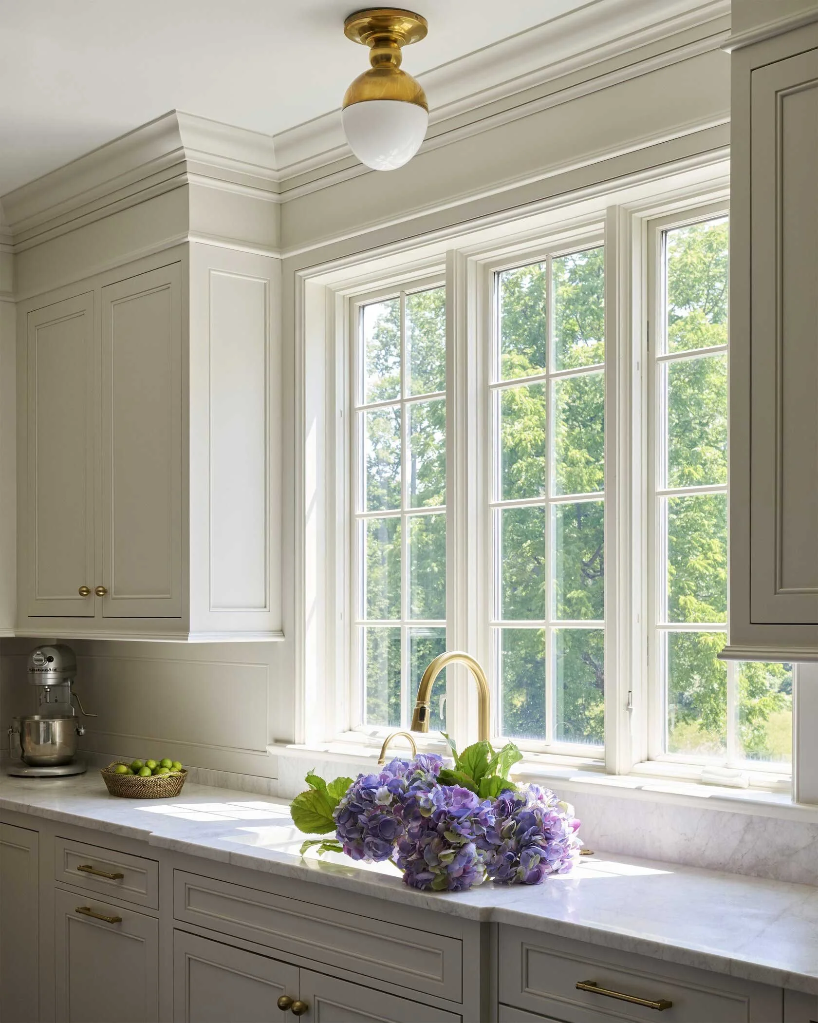 kitchen-sink-with-gold-faucet-and-flowers.jpg
