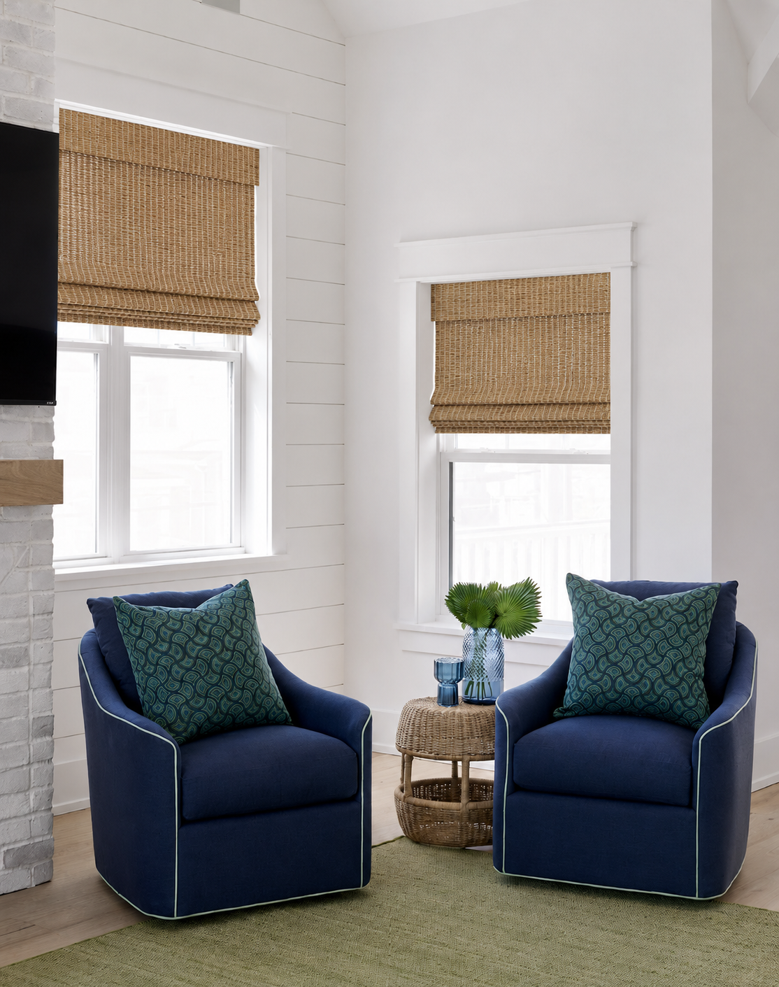 Two blue swivel chairs in a living room.