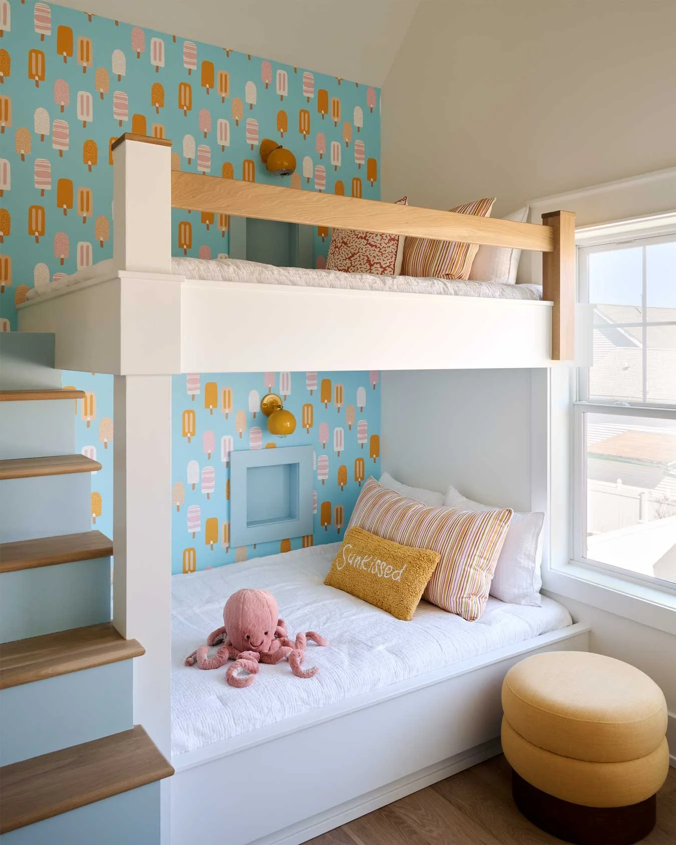 Children's bedroom with bunk beds and popsicle theme wallpaper