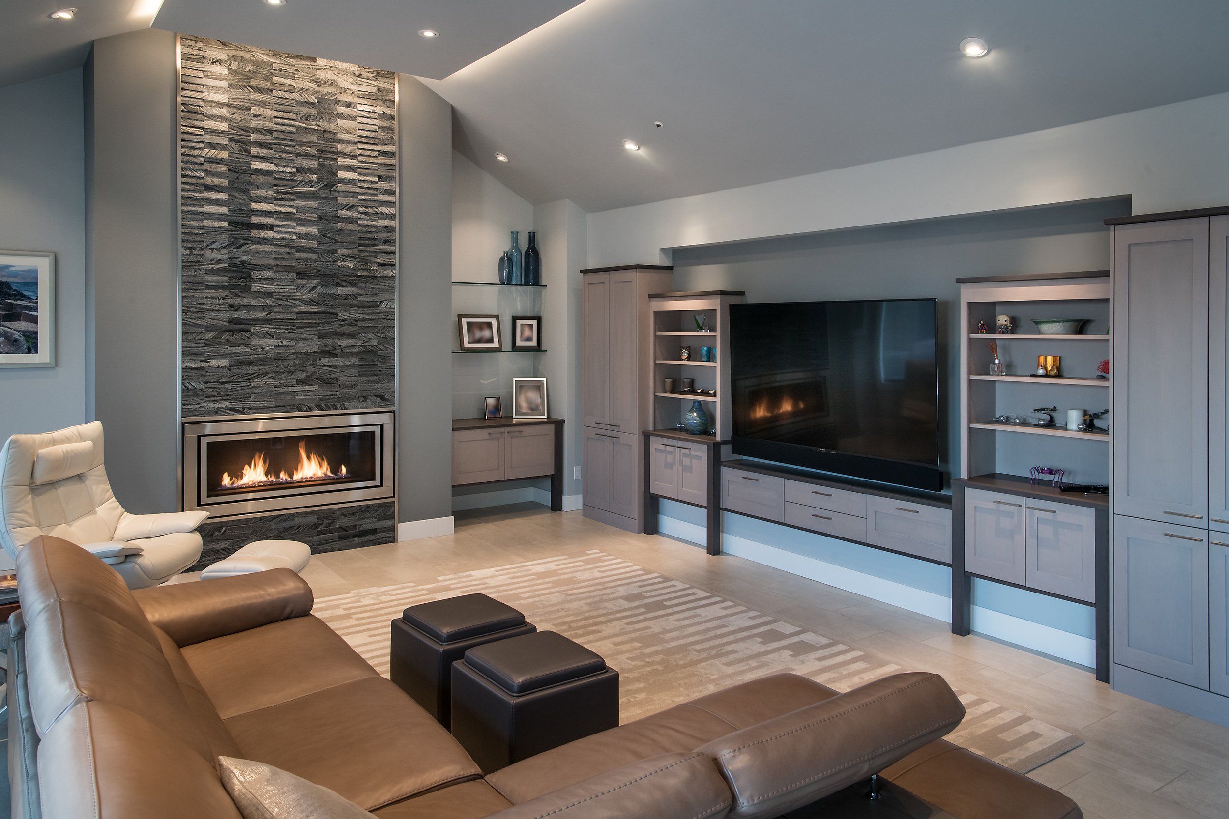 Family Spaces Home Remodel 1 - Entertainment center, furniture style, modern fireplace, gray stone, indirect lighting.jpg