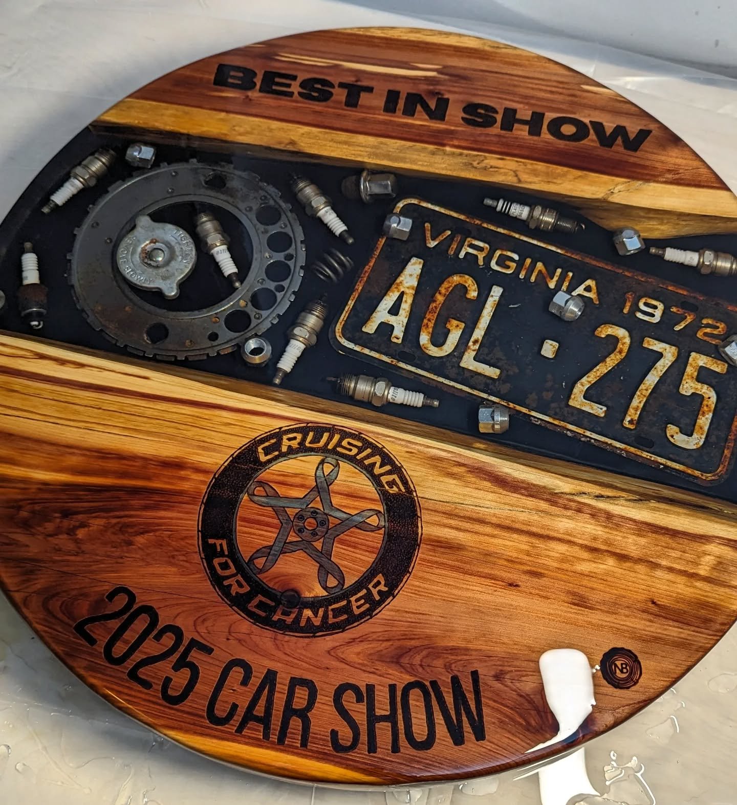 15 days until the 3rd Annual Cruising for Cancer Car Show &mdash; and this bad boy right here? That&rsquo;s the Best in Show trophy. It&rsquo;s an epoxy table filled with real car parts, made by a real cancer patient (me), in between chemo rounds lik