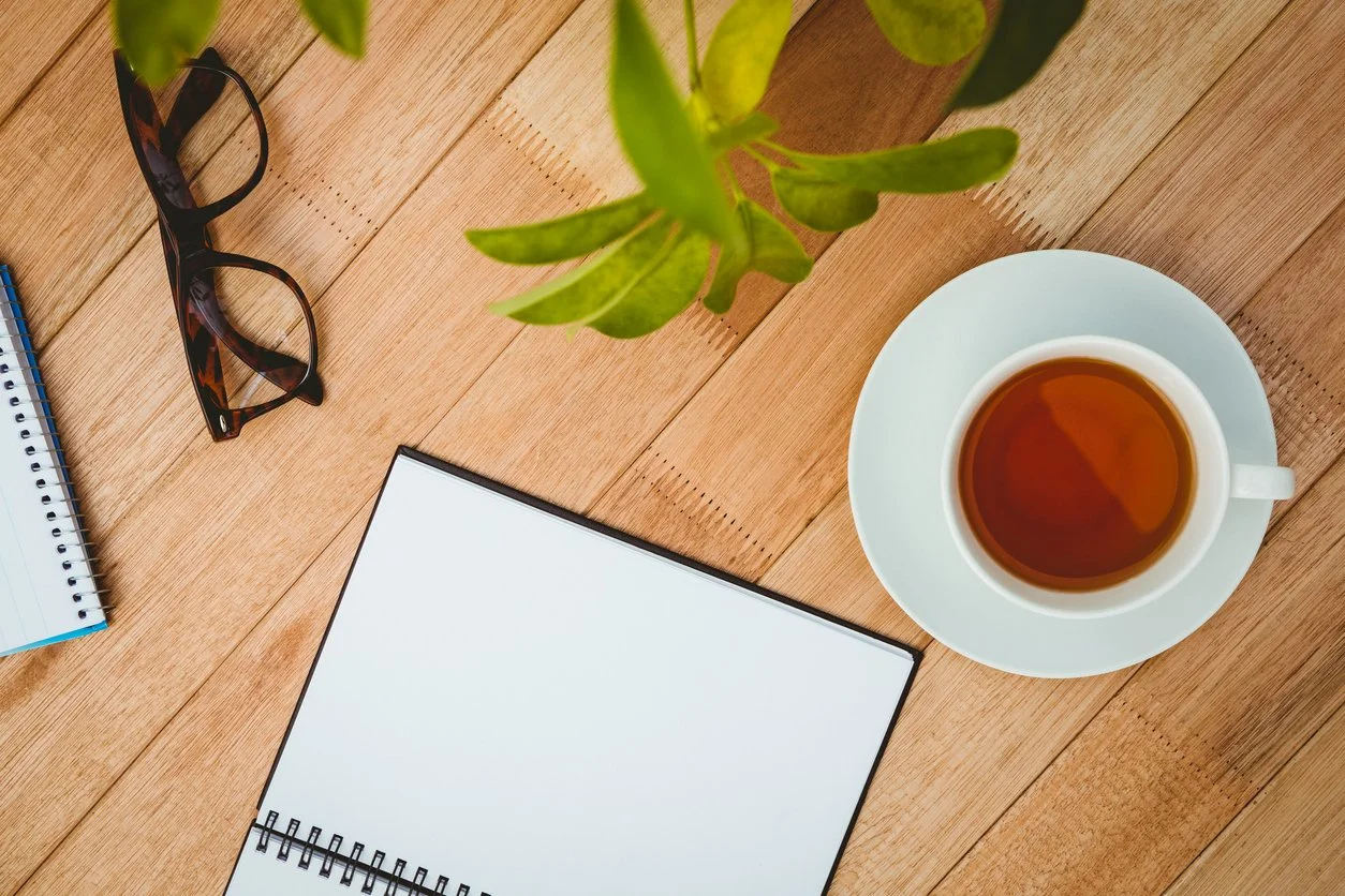 tea, glasses and notebook