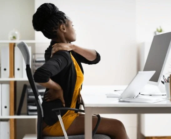 Desk worker with upper back and neck pain caused by posture, treated with physical therapy in Aurora