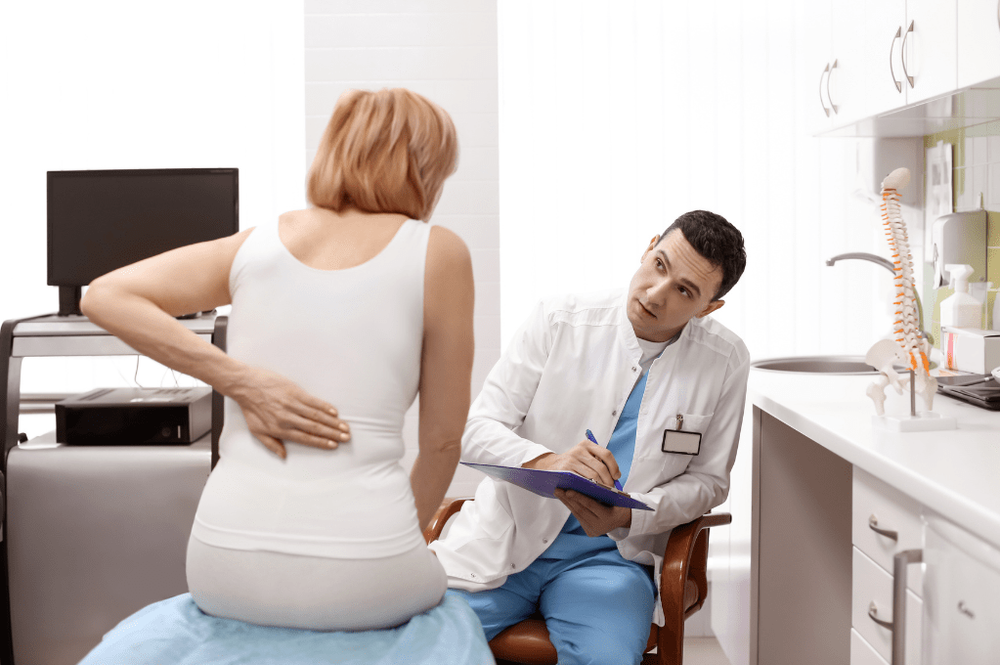 Pain management physician evaluating a patient in Denver