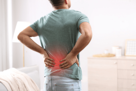 Lower back pain highlighted in red from poor posture