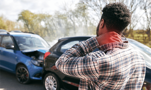 Man holding his neck after a rear-end car accident