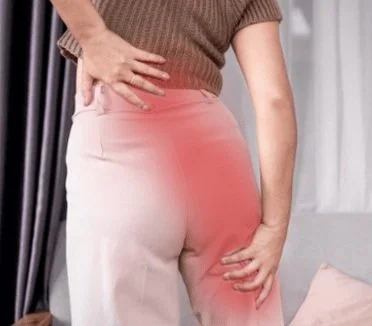 Patient with sciatic nerve pain running down the leg