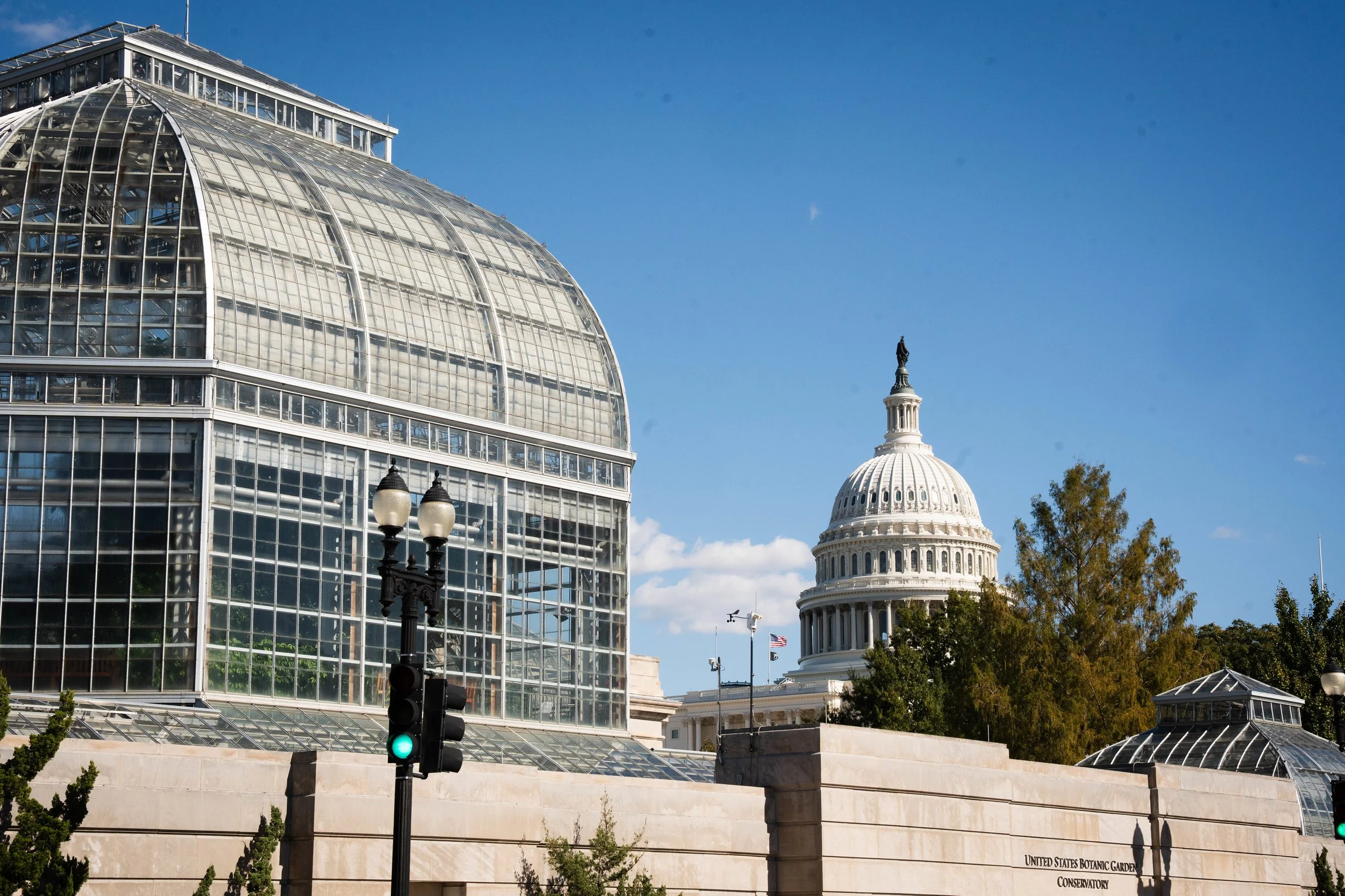 Aerial view of a coastal city with beachfront high-rise buildings and a turquoise ocean.