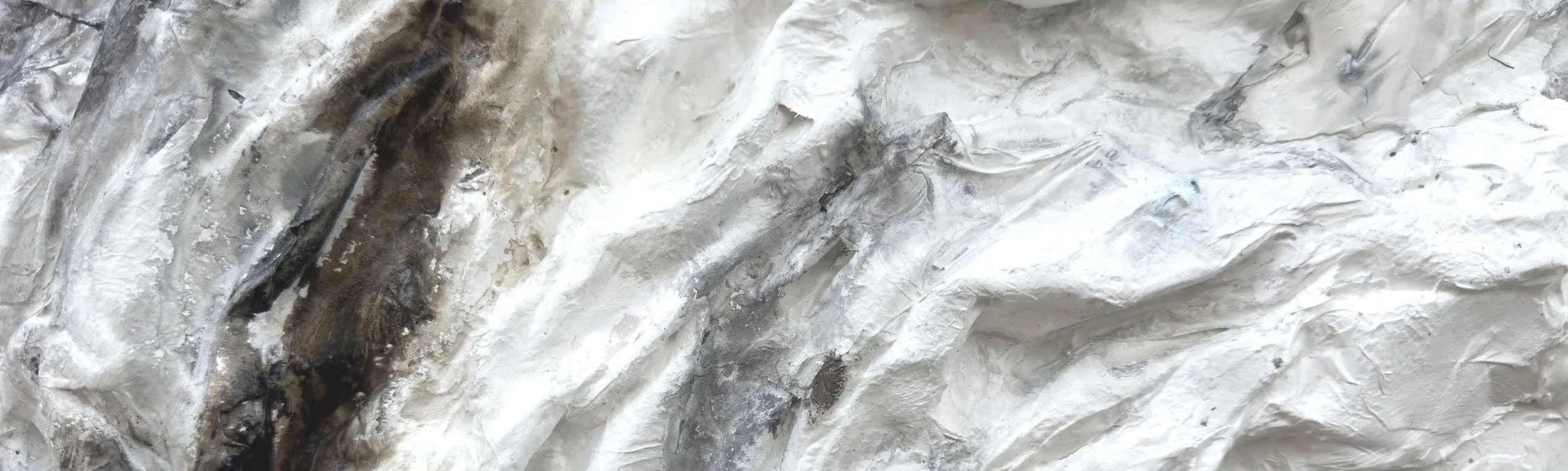 Layered surface paintings evoking erosion, geology, and sediment