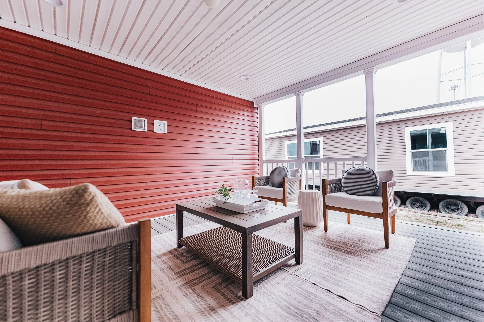 covered porch with sliding glass door entry into the kitchen area of the cavco dakota 