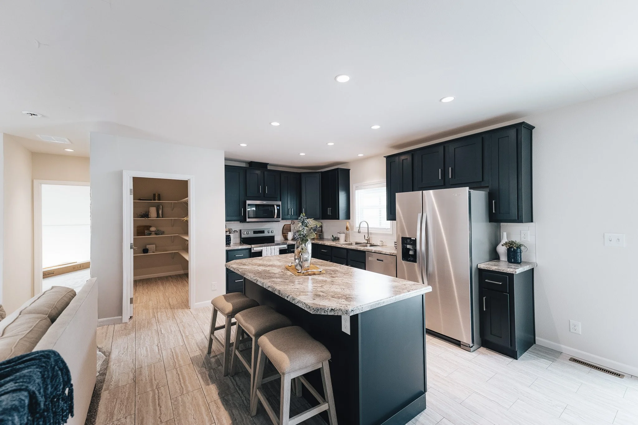 kitchen photo with black cabinets inside the BonnaVilla 2764 Premier Limited