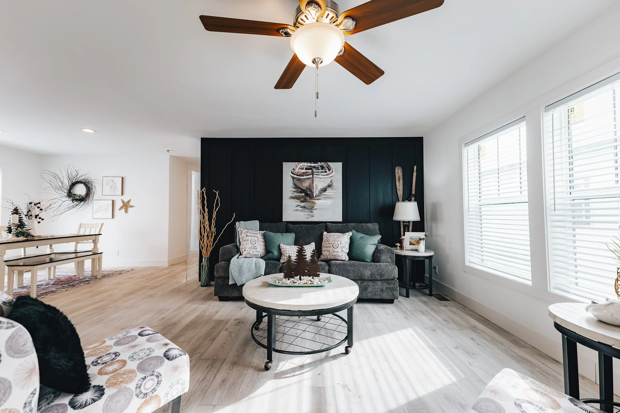 livingroom photo inside the schult Ramsey 2022-1 manufactured home with black board and batton acent wall