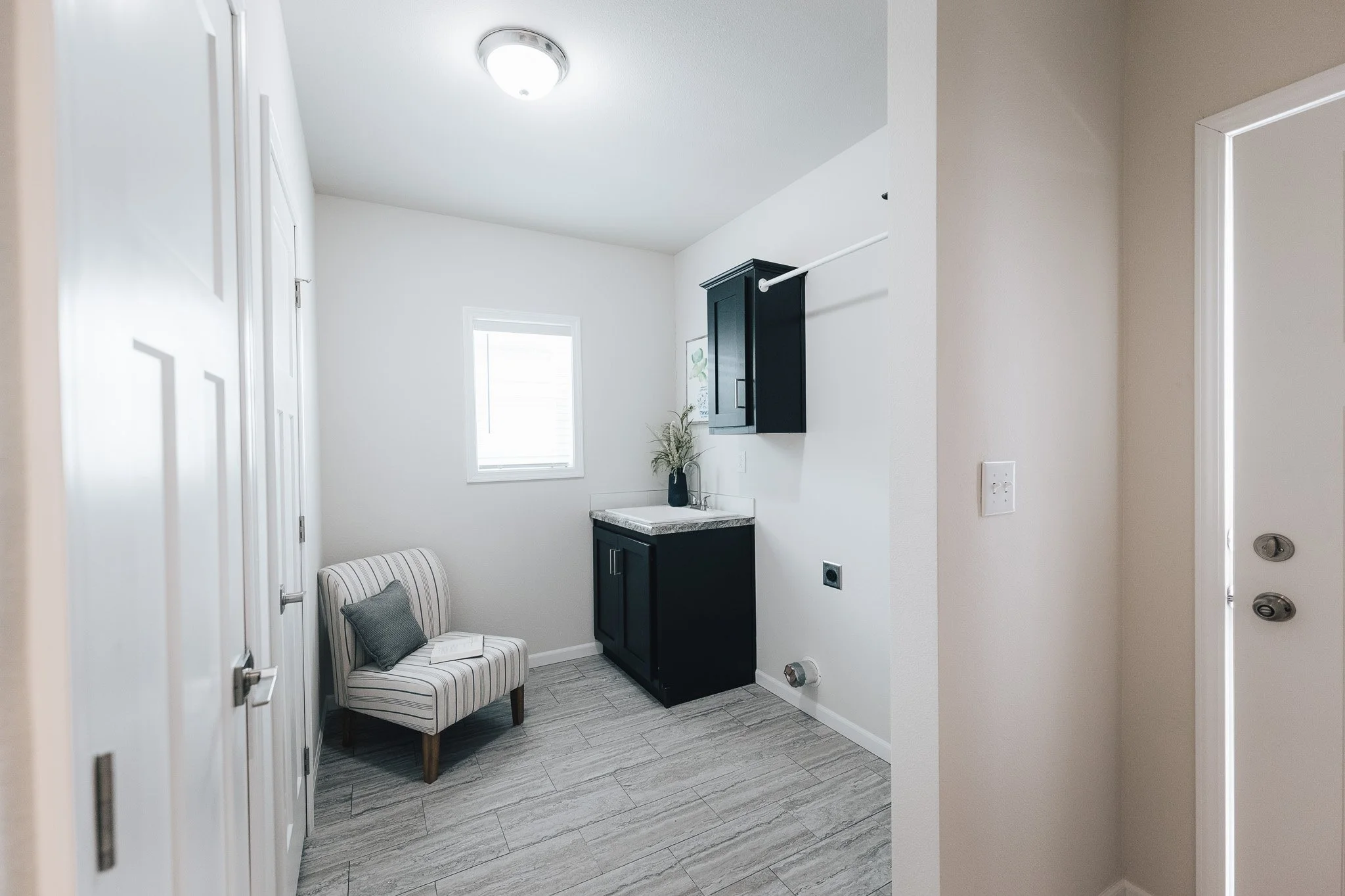 laundry room photo in the BonnaVilla 2764 Premier Limited