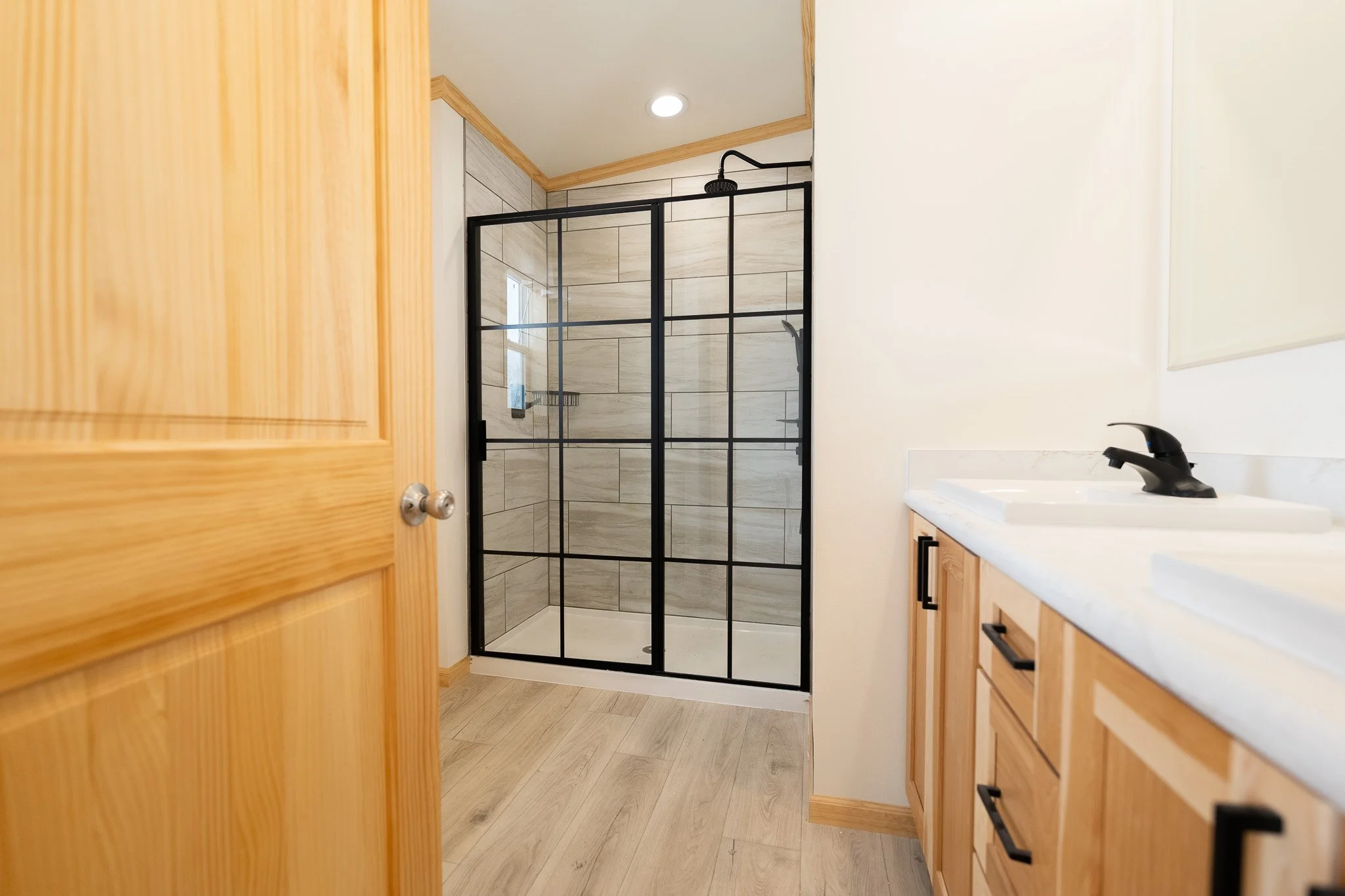 master bathroom photo with duel vanity and walk in tiled shower cavco westlake retreat 28523E