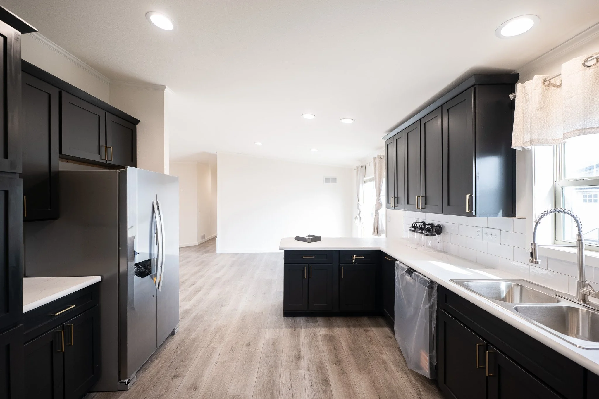photo of the kitchen with black cabinets inside the westalke ranch 