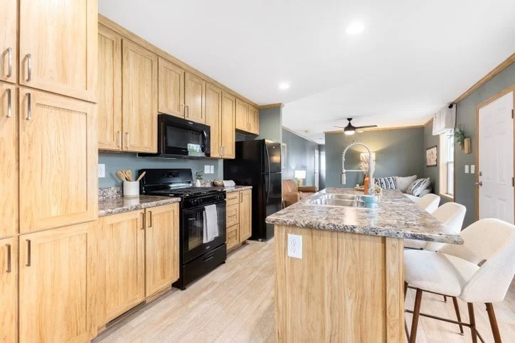 interior photo of kitchen with light brown cabinets cavco singlewide 