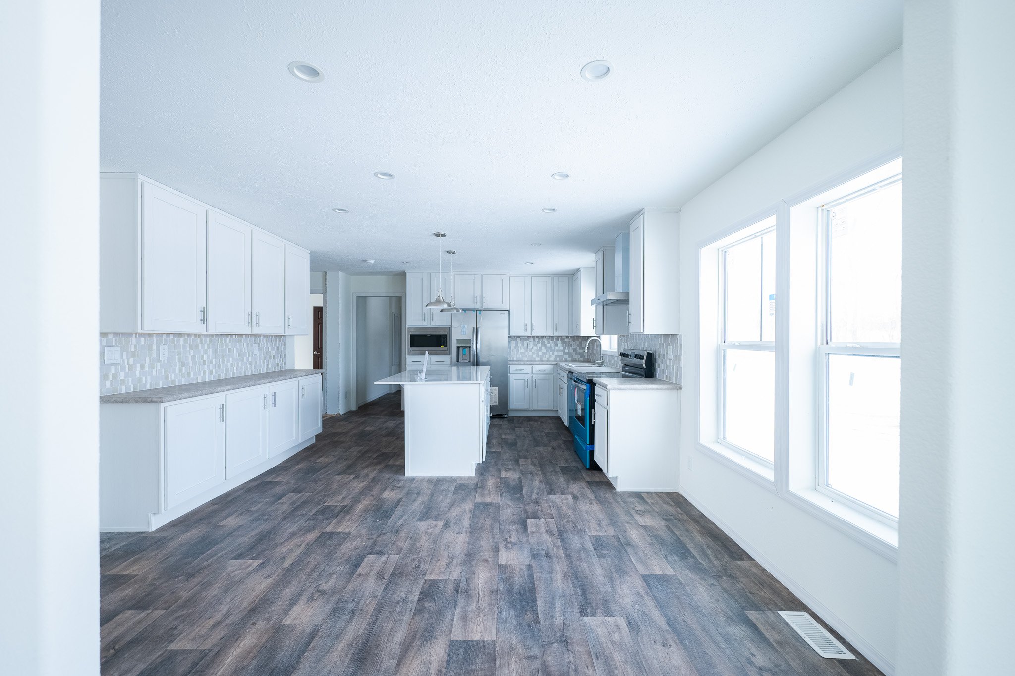 photo of kitchen from the perspective of the sunroom looking into the kitchen schult legend 377 manufactured home 