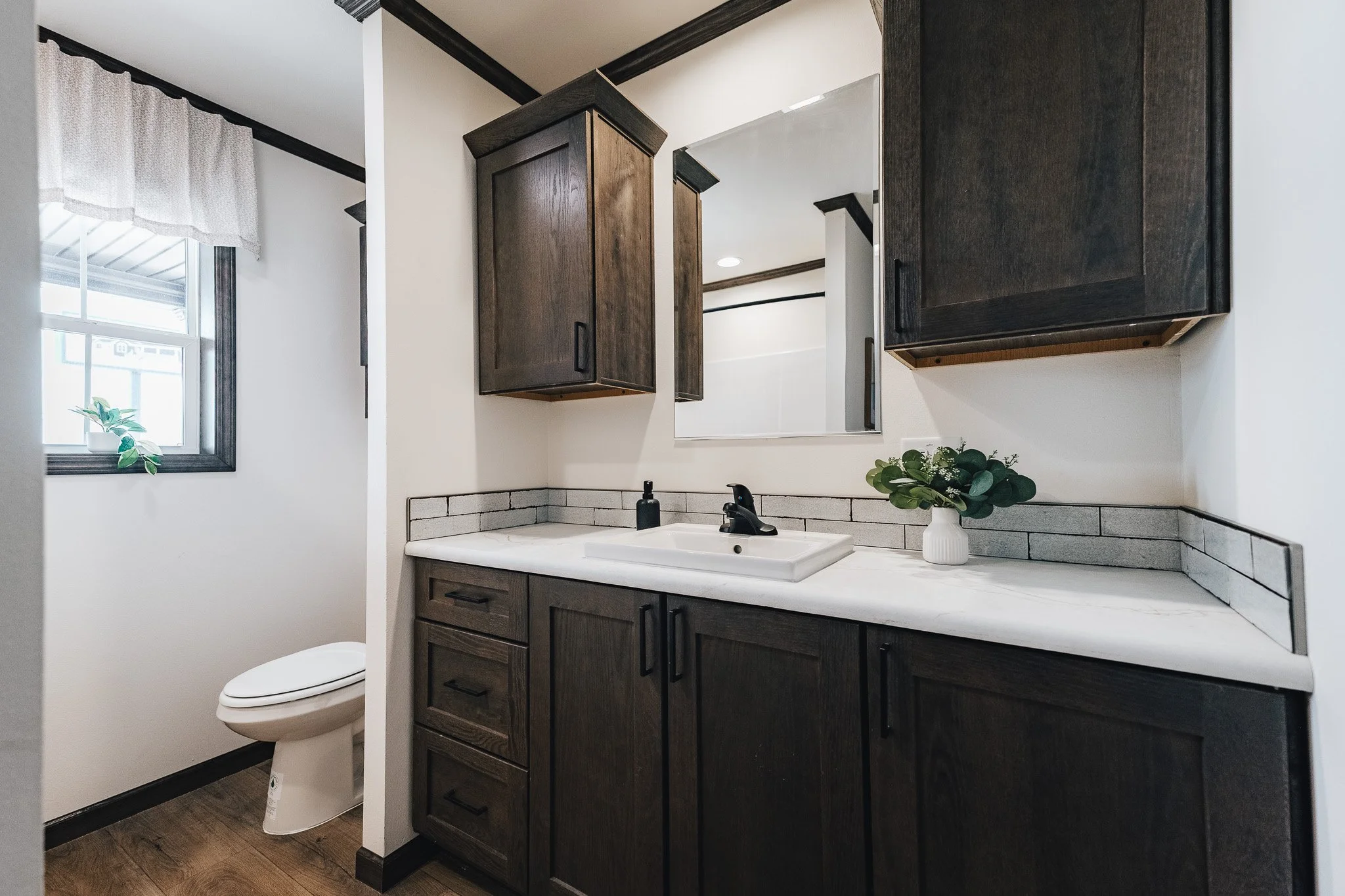 front livingroom bathroom with single vanity with full tub shower