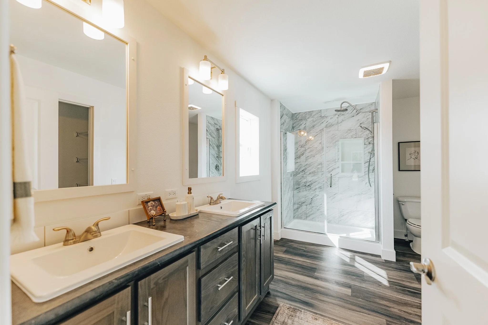master bathroom with tiled shower inside the schult Legend 86 Manufactured Home