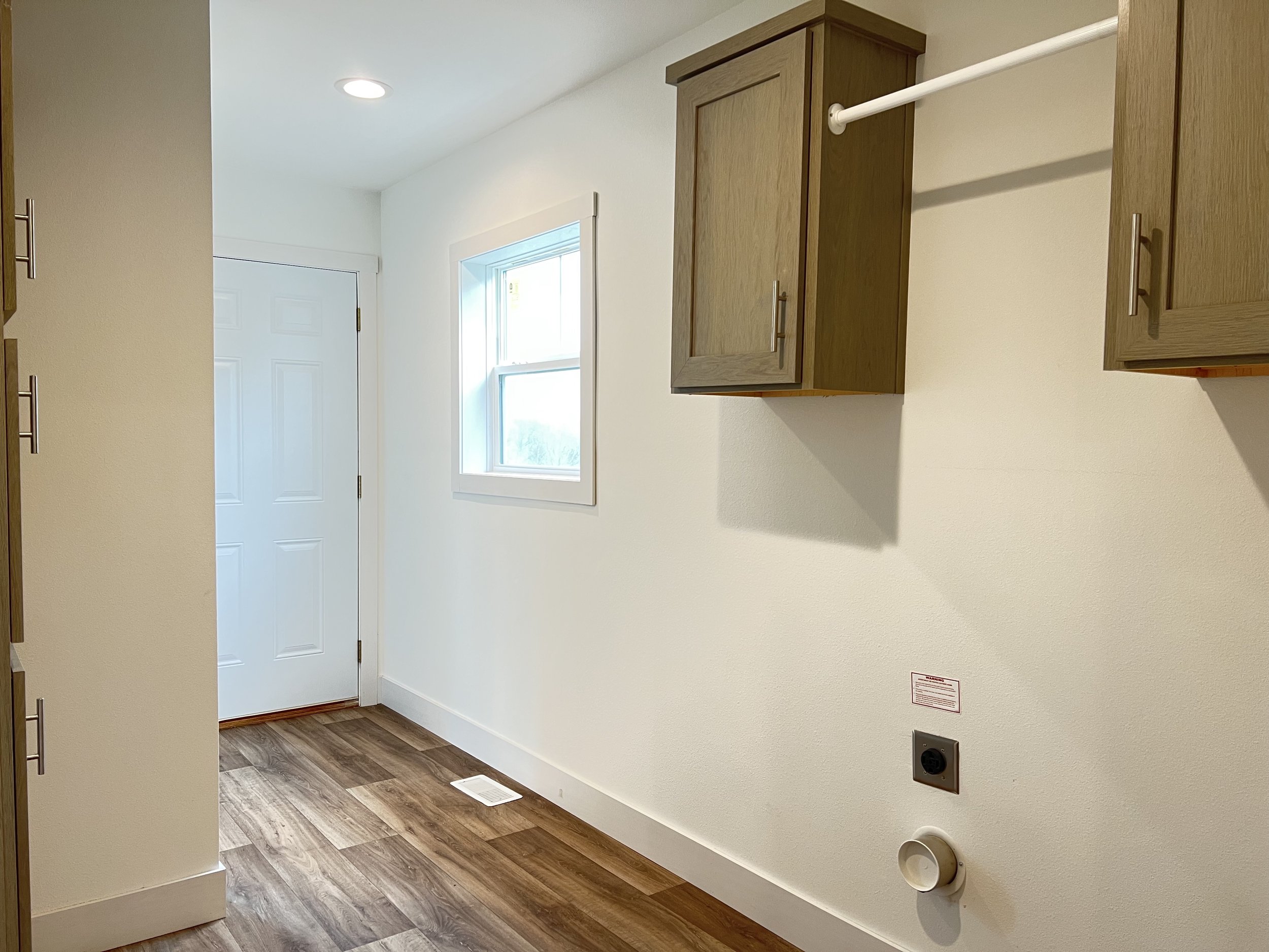 laundryroom with end entry off of the kitchen schult ramsey 2022-1