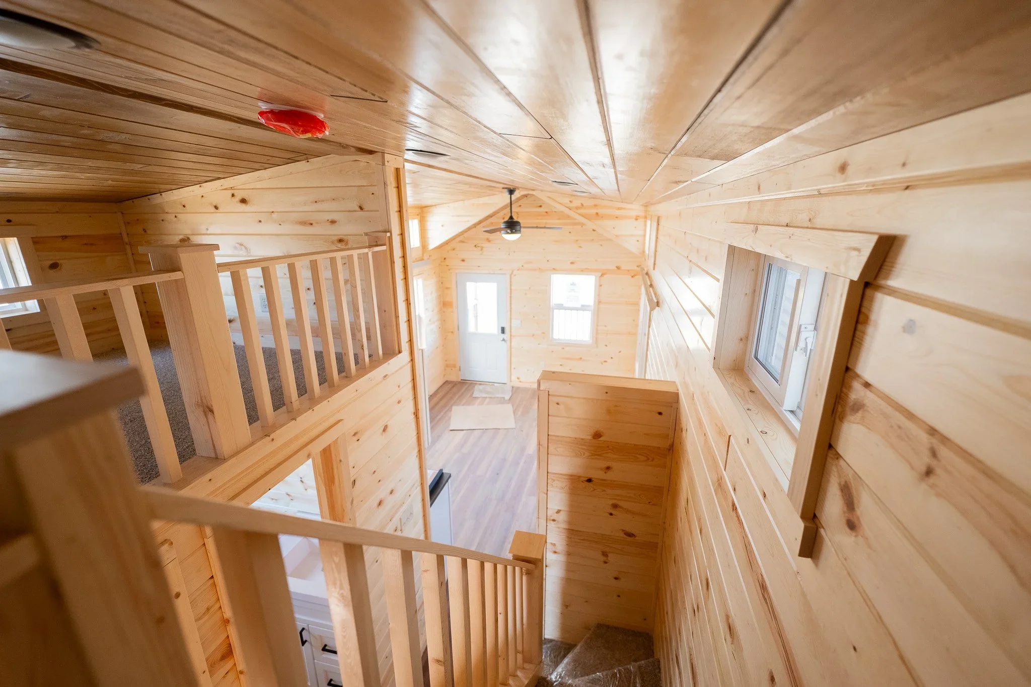 staircase shot of going down into main living area from the loft area