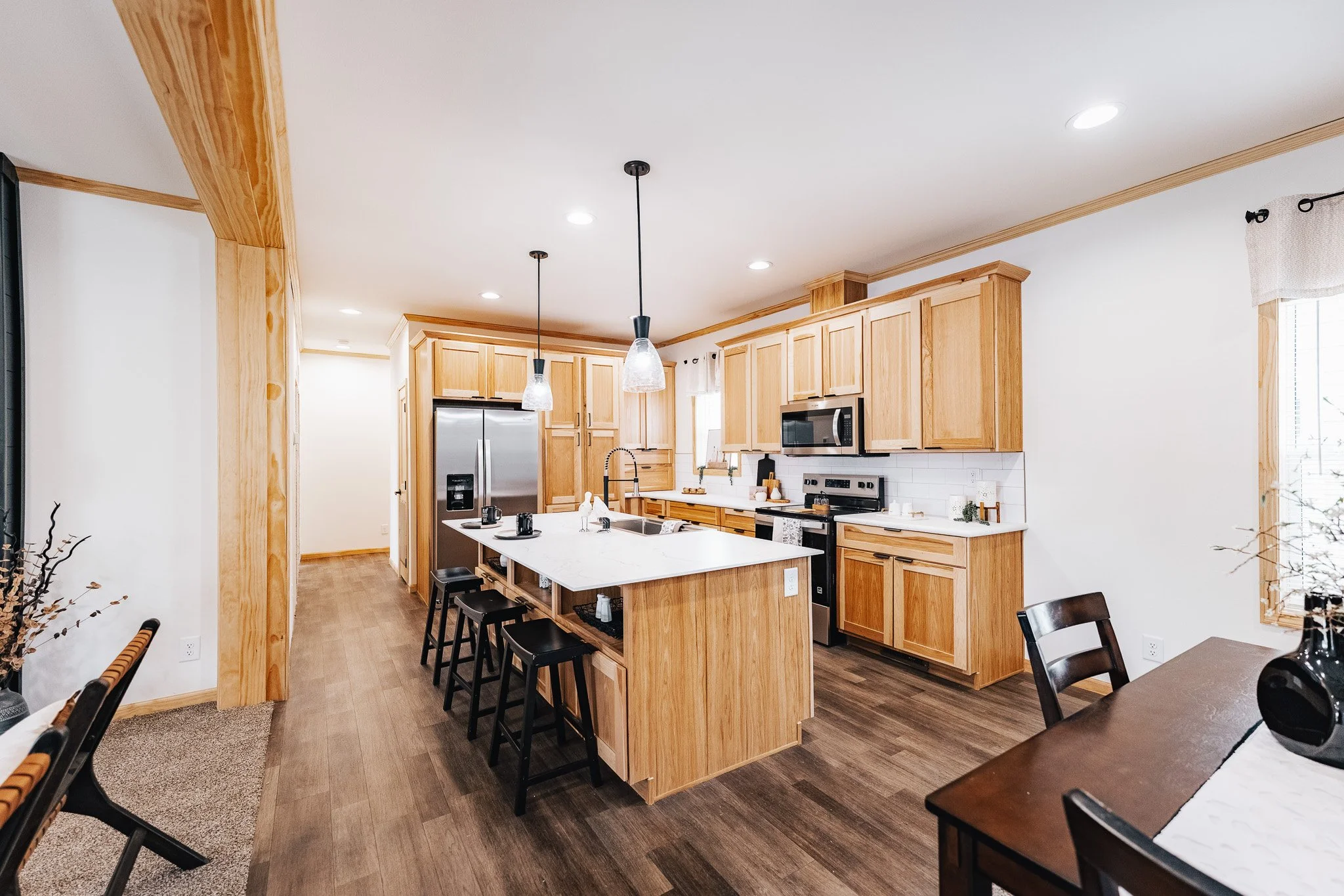 interior photo of the kitchen with nice pine and alder wood cabinets 
