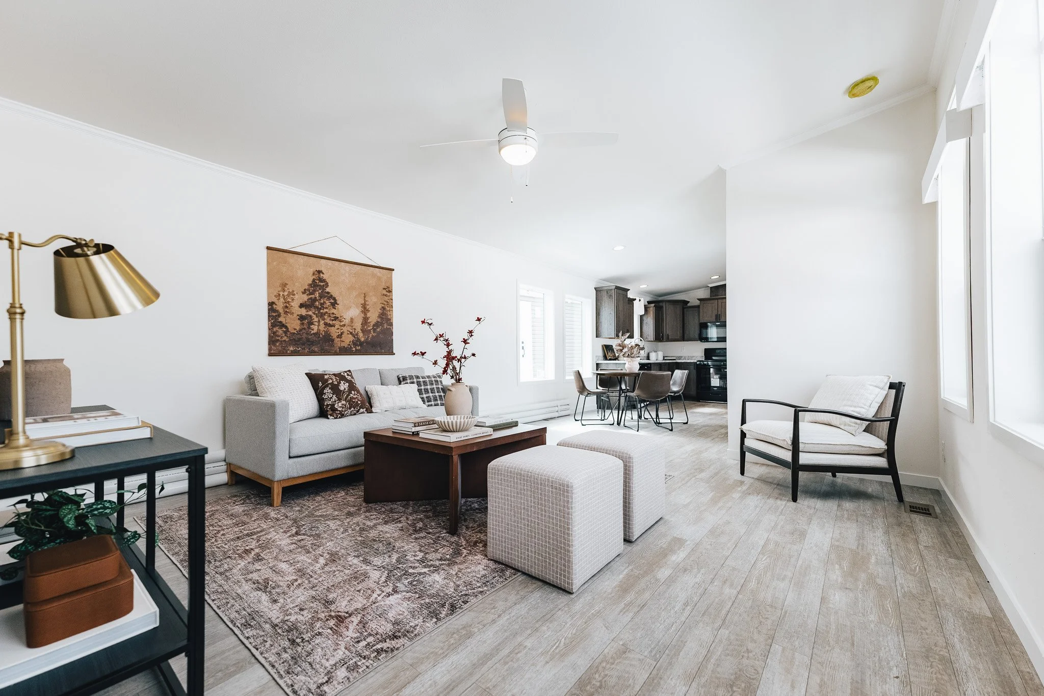 livingroom photo inside the cavco westlake retreat with livingroom furniture and art facing the kitchen 