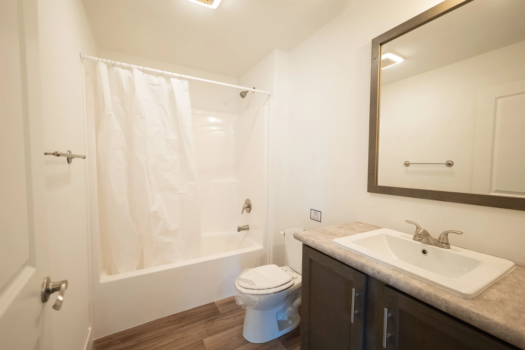 secondary bathroom inside the legend 413 manufactured home 