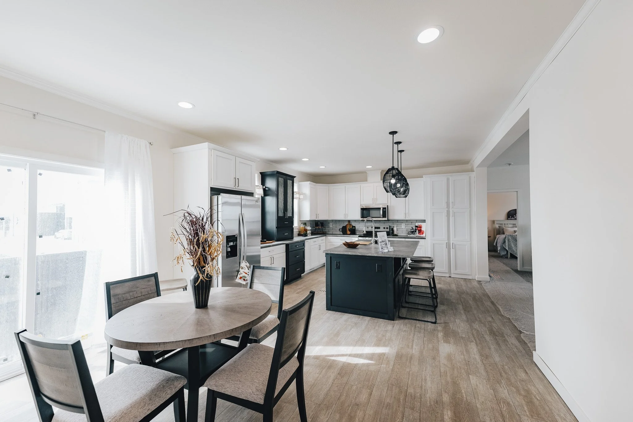 photo of dinningroom into kitchen with white cabinets cavco sapphire 