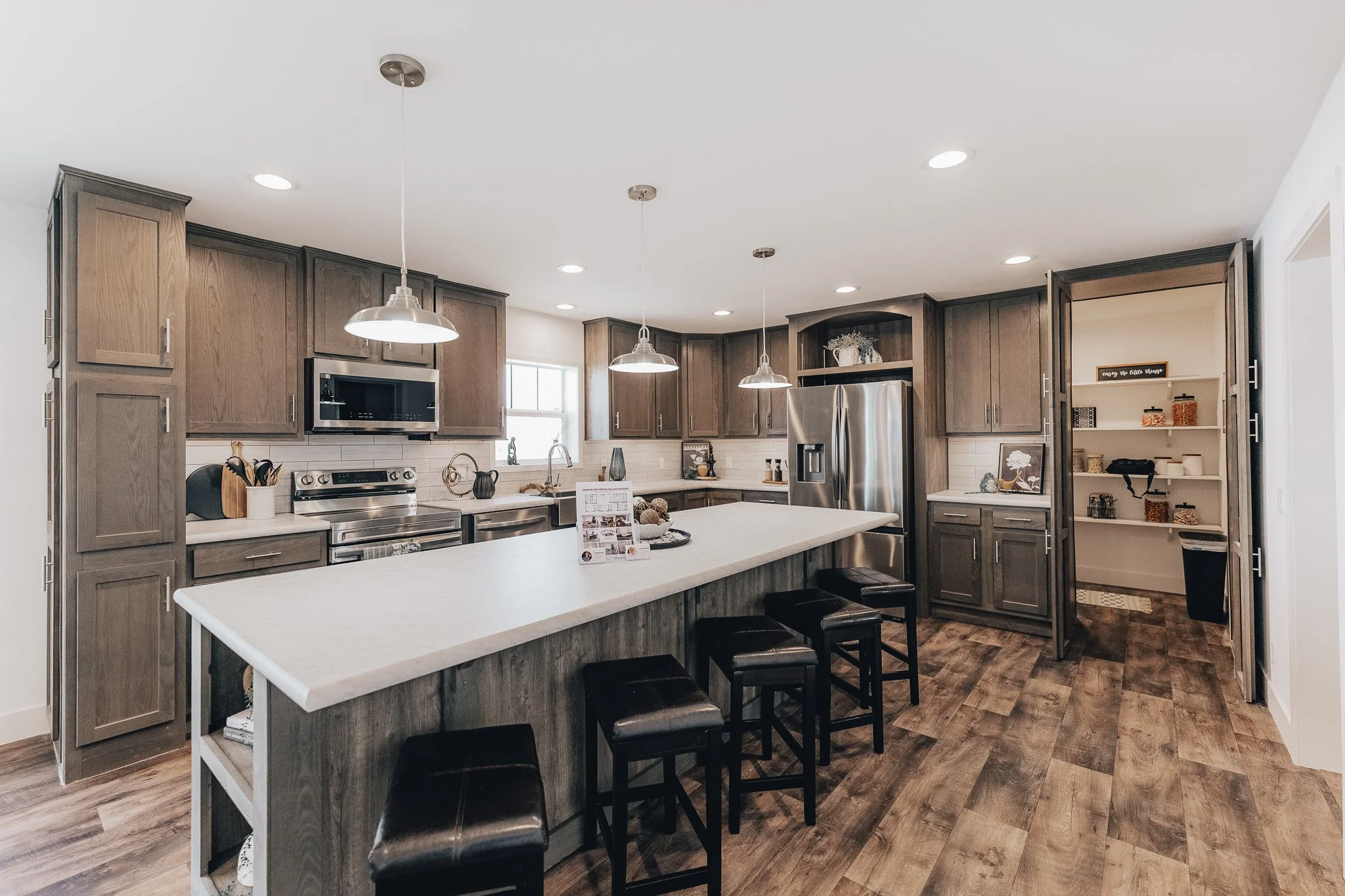 kitchen photo with large walk in pantry and big island