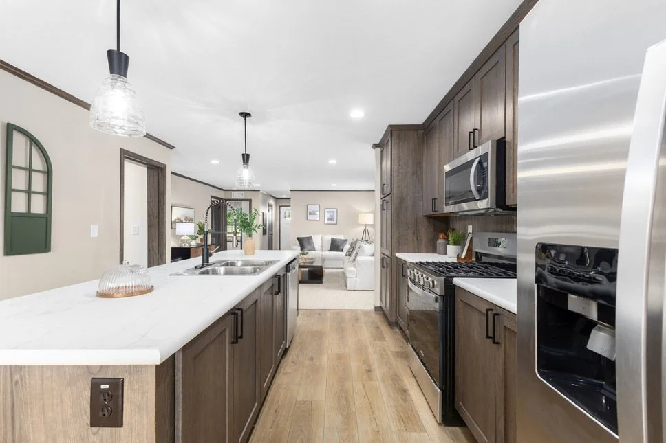kitchen photo with island and gray cabinets inside the cavco manufactured home 