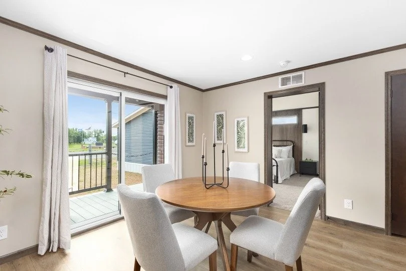 dinning room photo with sliding glass door in view and master bedroom door in view 