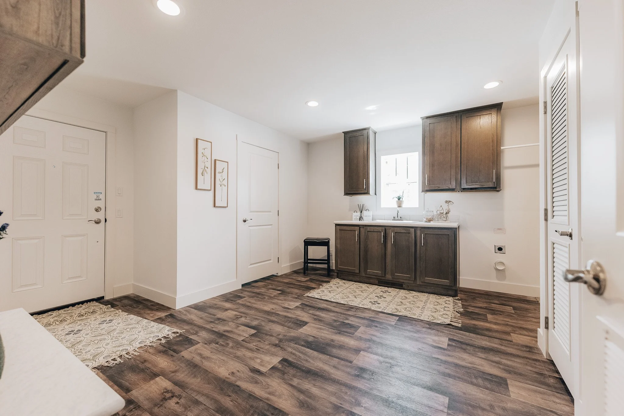 large mudroom with sink and half bathroom inside modular homes in Bismarck North Dakota