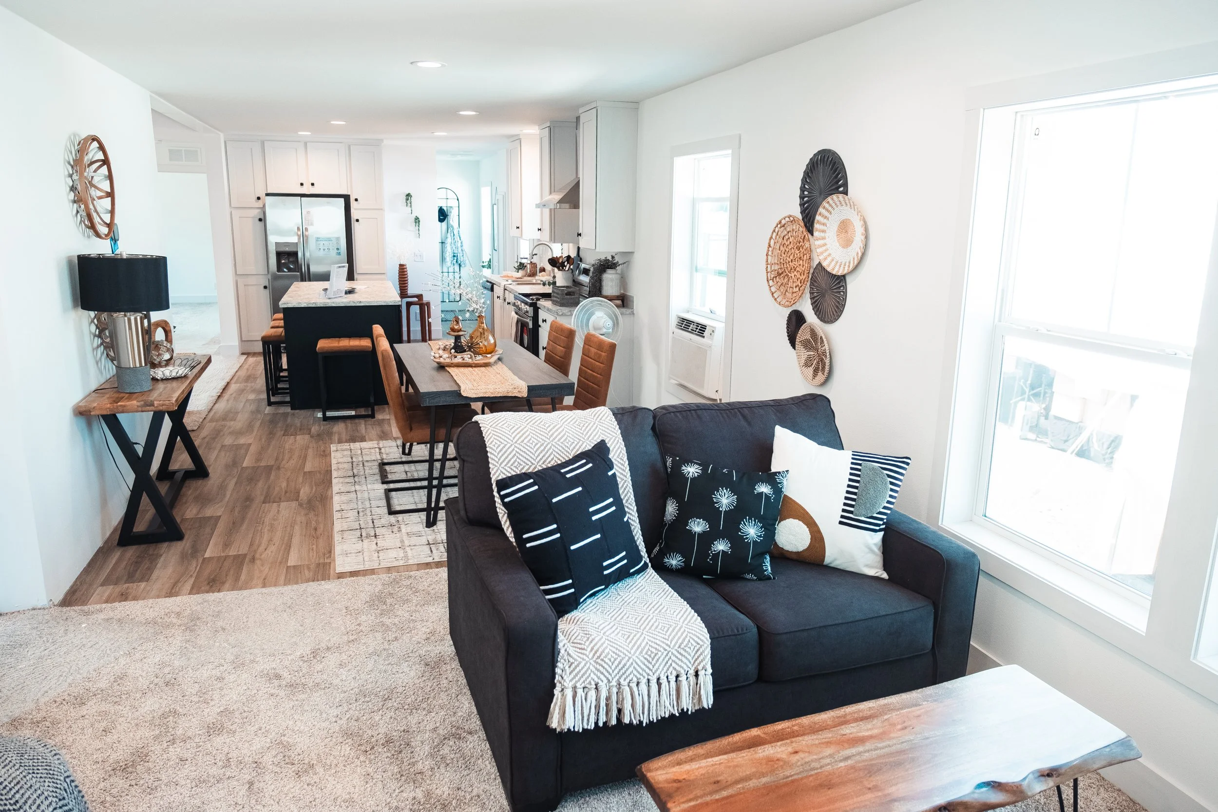 living room photo looking through dinning room and livingroom into the kitchen in the background