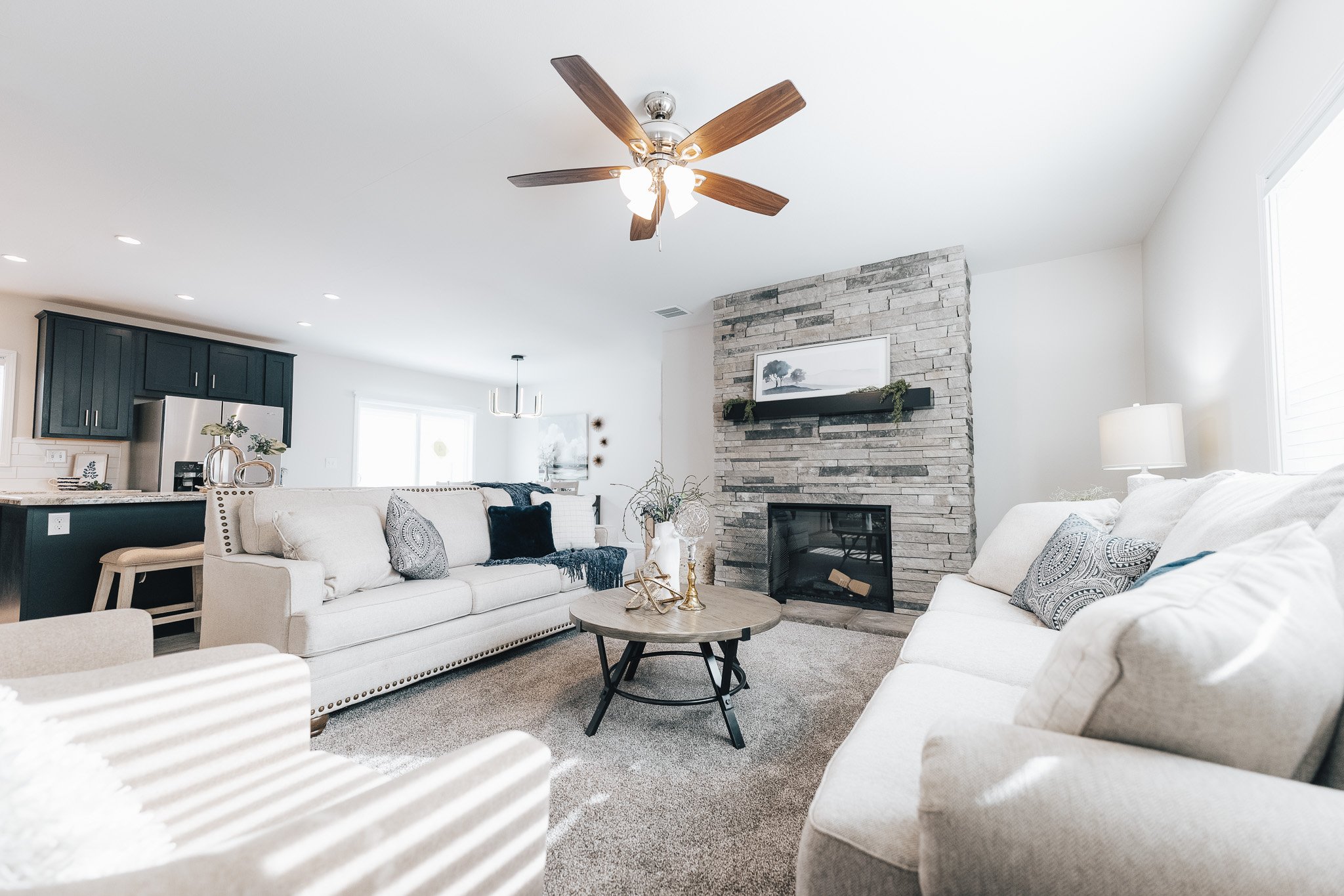 interior photo of livingroom and stone fire place in the bonnavilla 2764 premier limited 