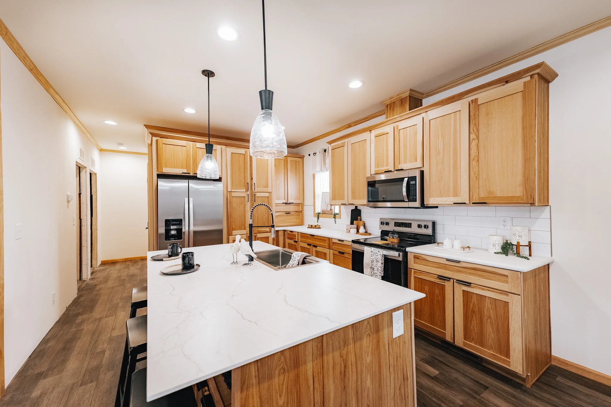 interior photo of the kitchen with nice pine and alder wood cabinets 