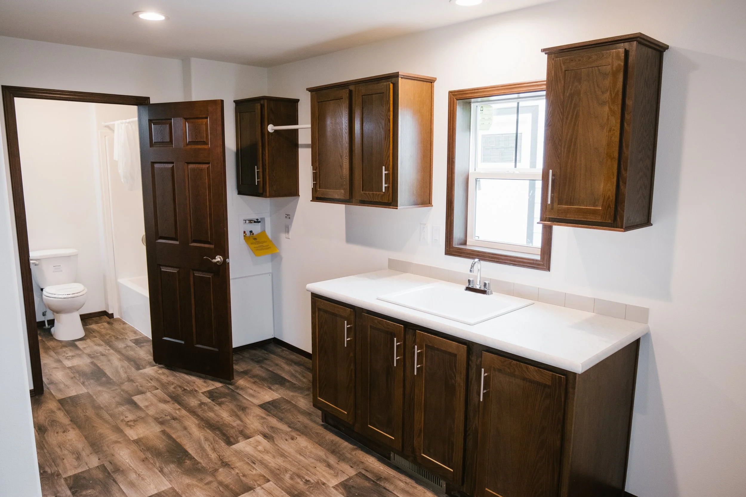 large utility room with small water closet bathroom 