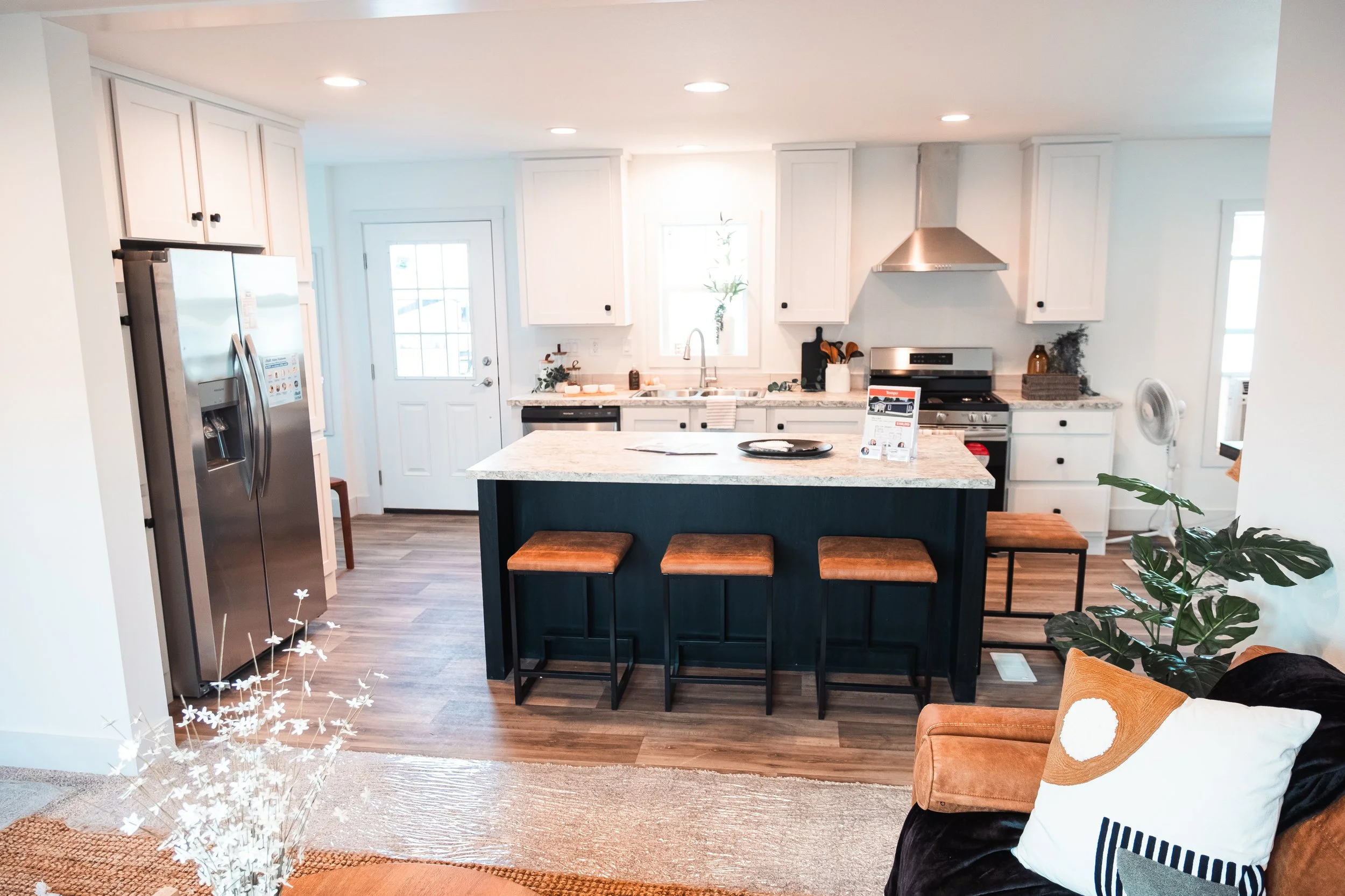 kitchen photo with kitchen island and white cabinets 