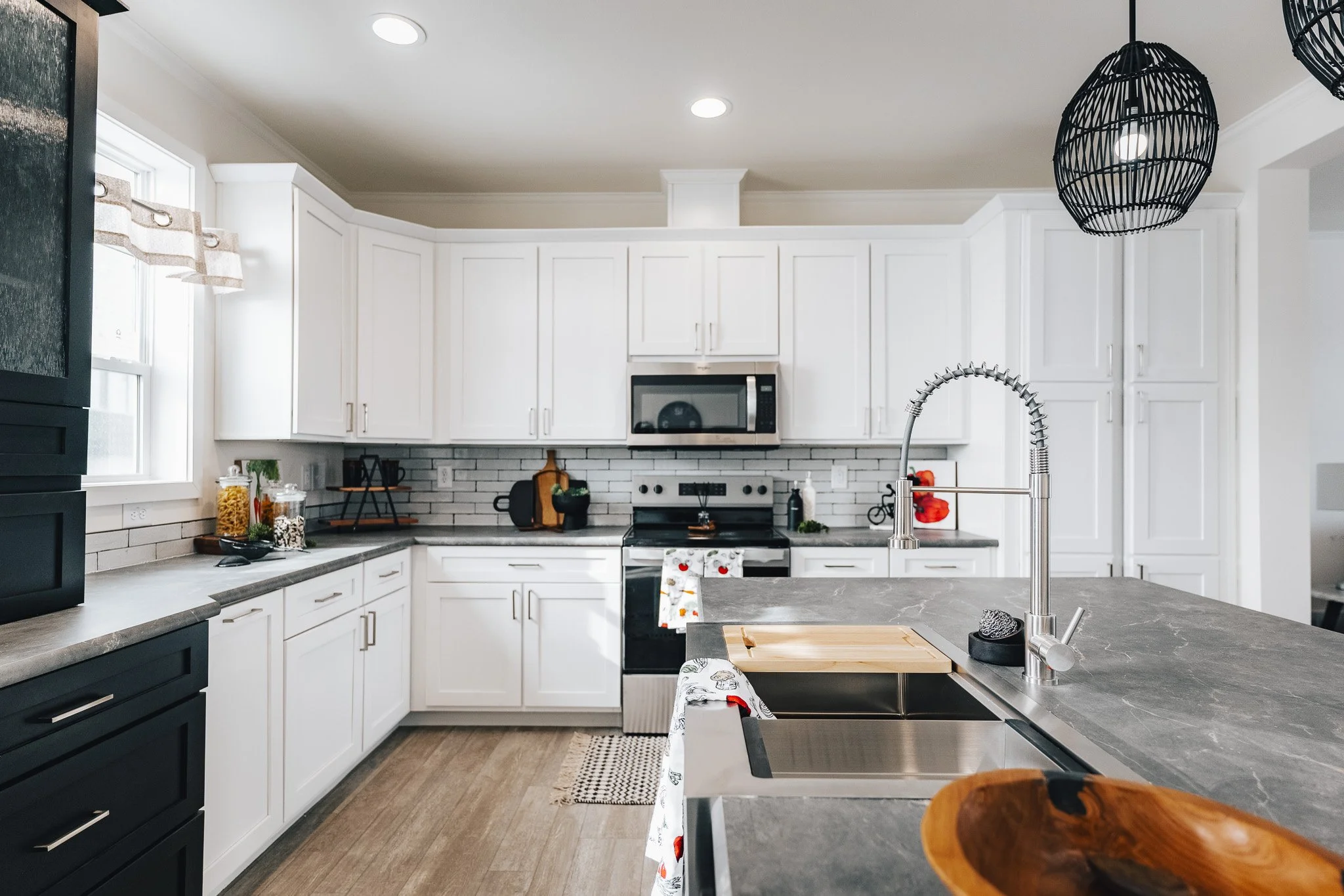 white cabinets and kitchen island inside cavco sapphire manufactured home
