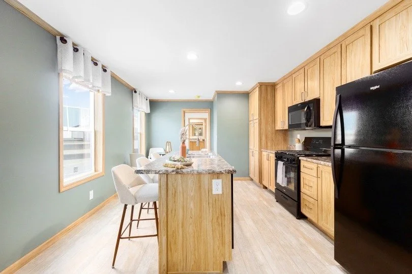 kitchen photo with island i frame and green walls with light brown cabinets 
