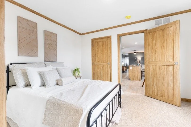 master bathroom photo looking into the kitchen through the bedroom door 