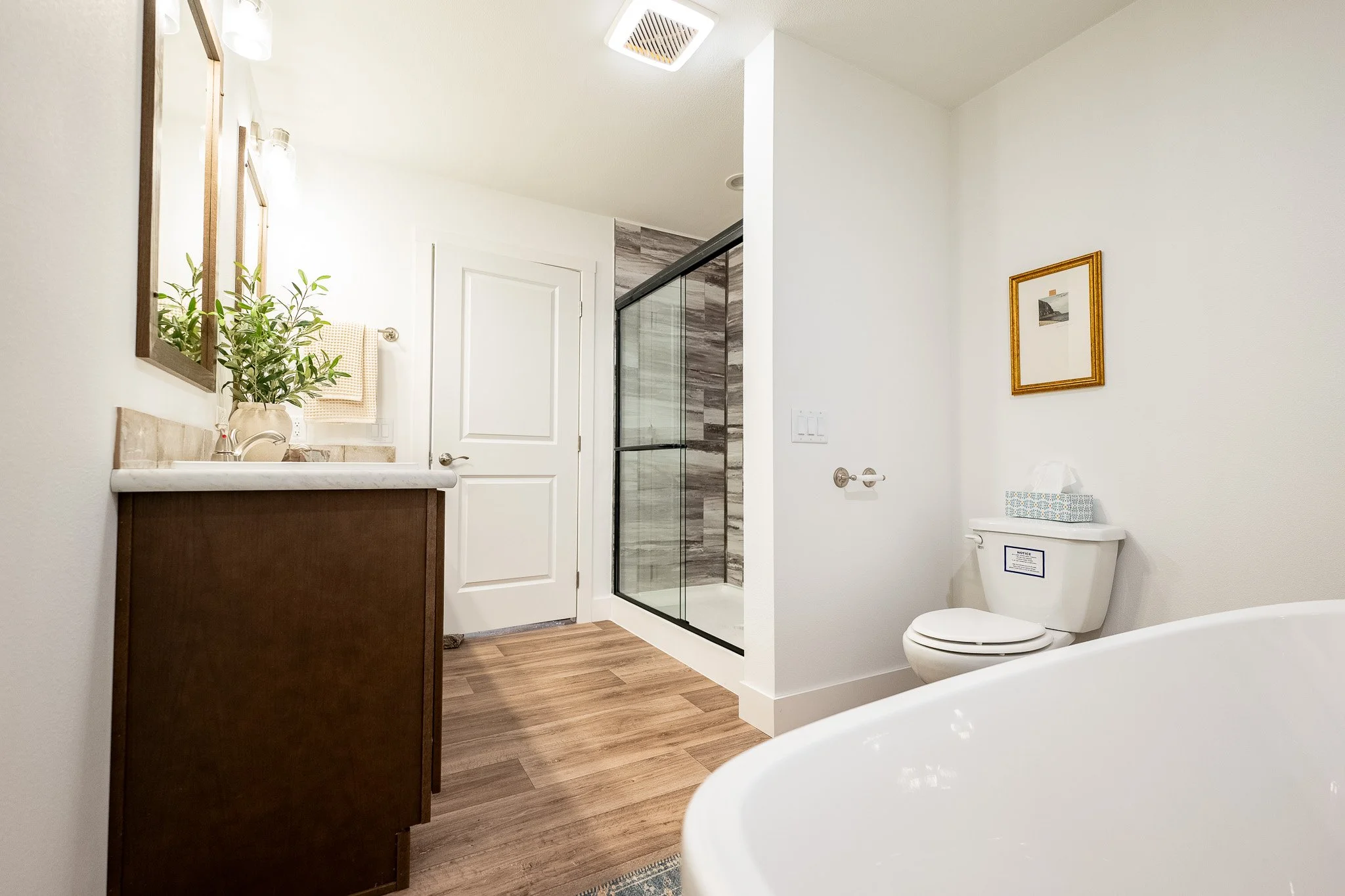 master bathroom photo with tiled shower in view in the schult legend 78 manufactured home 