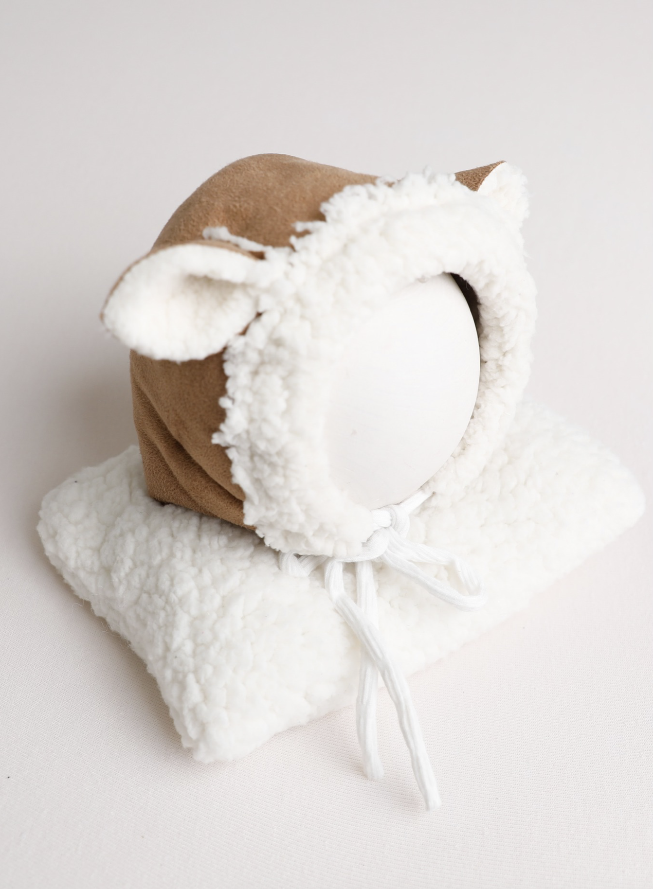 Fluffy deer pillow and bonnet