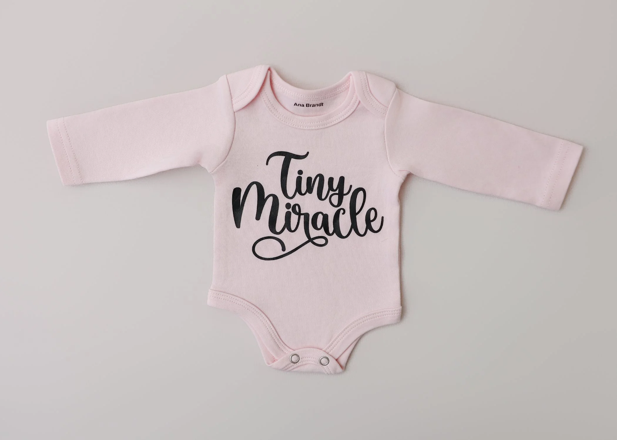 Tiny Miracle – Newborn Long-Sleeve Onesie (Soft Blush)
