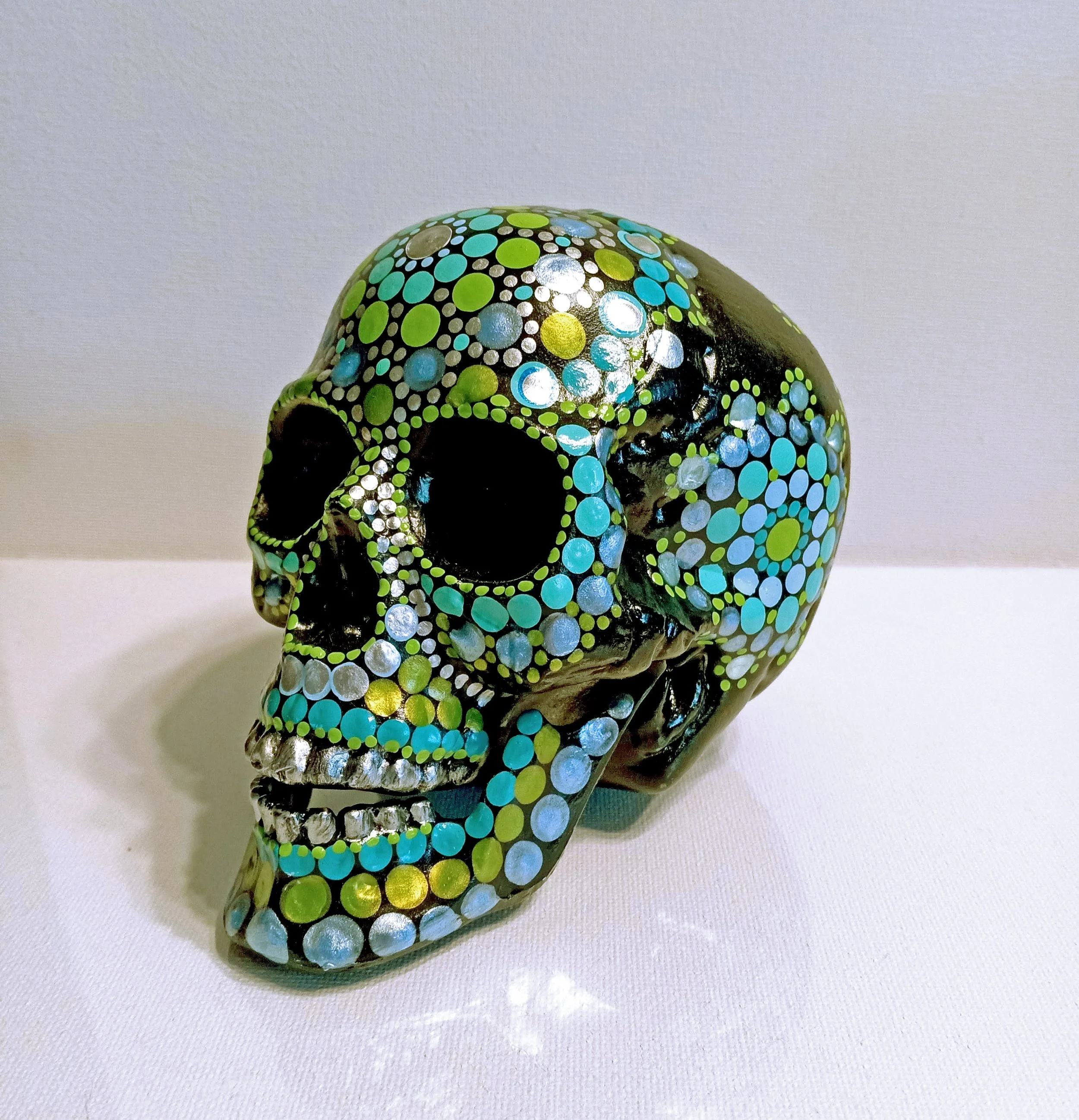 green and turquoise skull front left.jpg