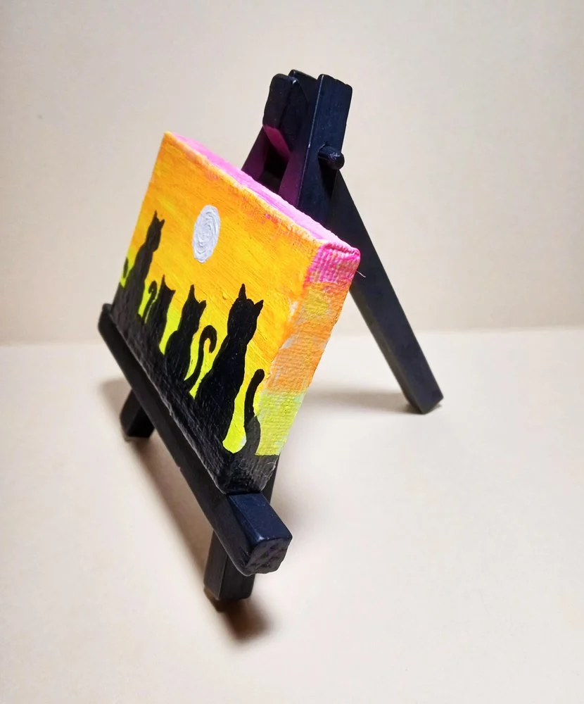 four sunset cats side view.jpg