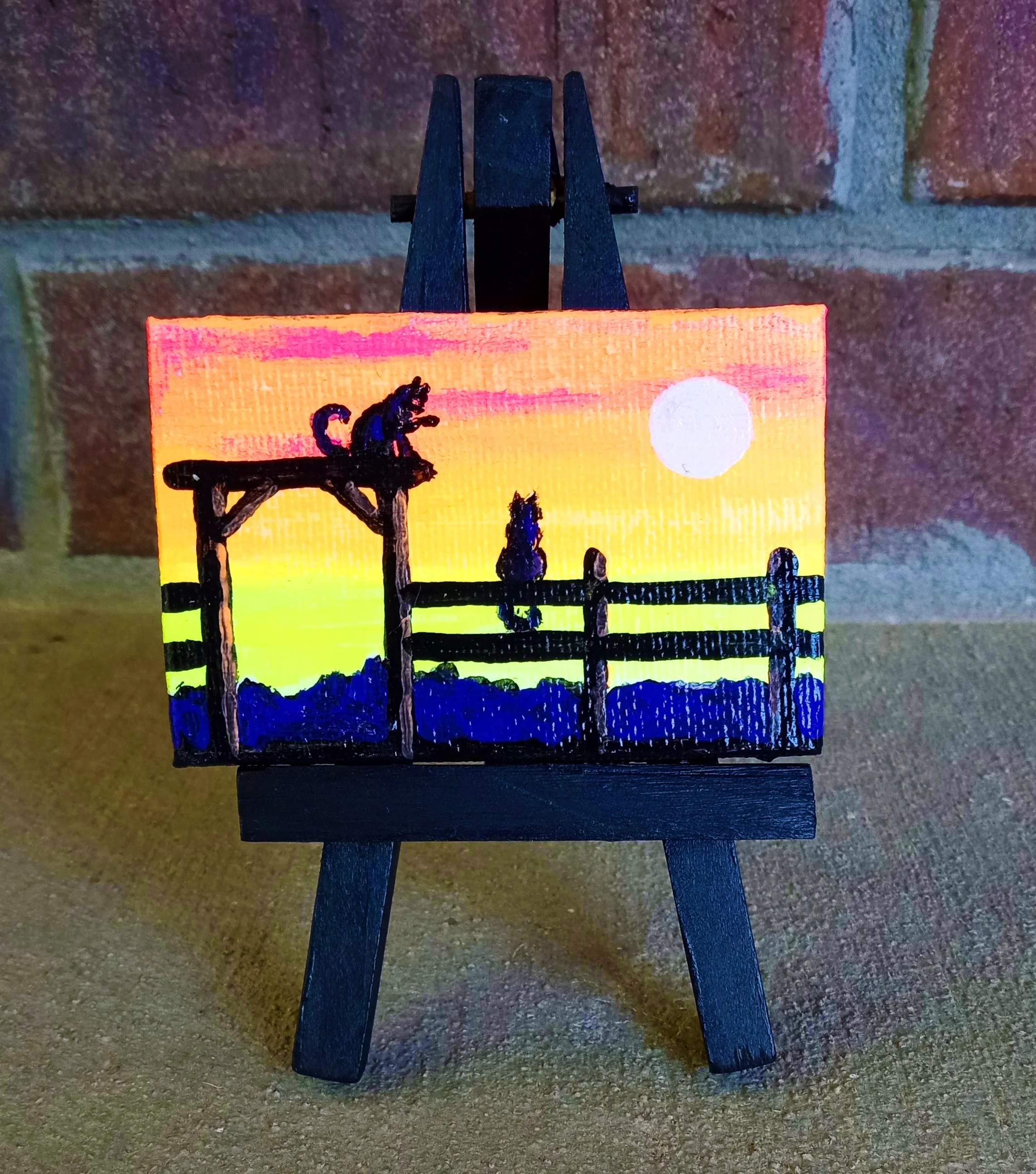 two sunset cats mini painting on easel.jpg
